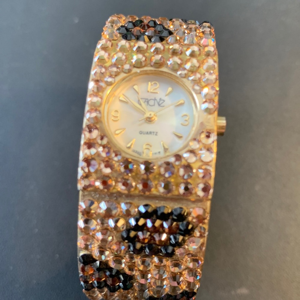 Cache watch like new gold and brown rhinestones making a leopard print gorgeous